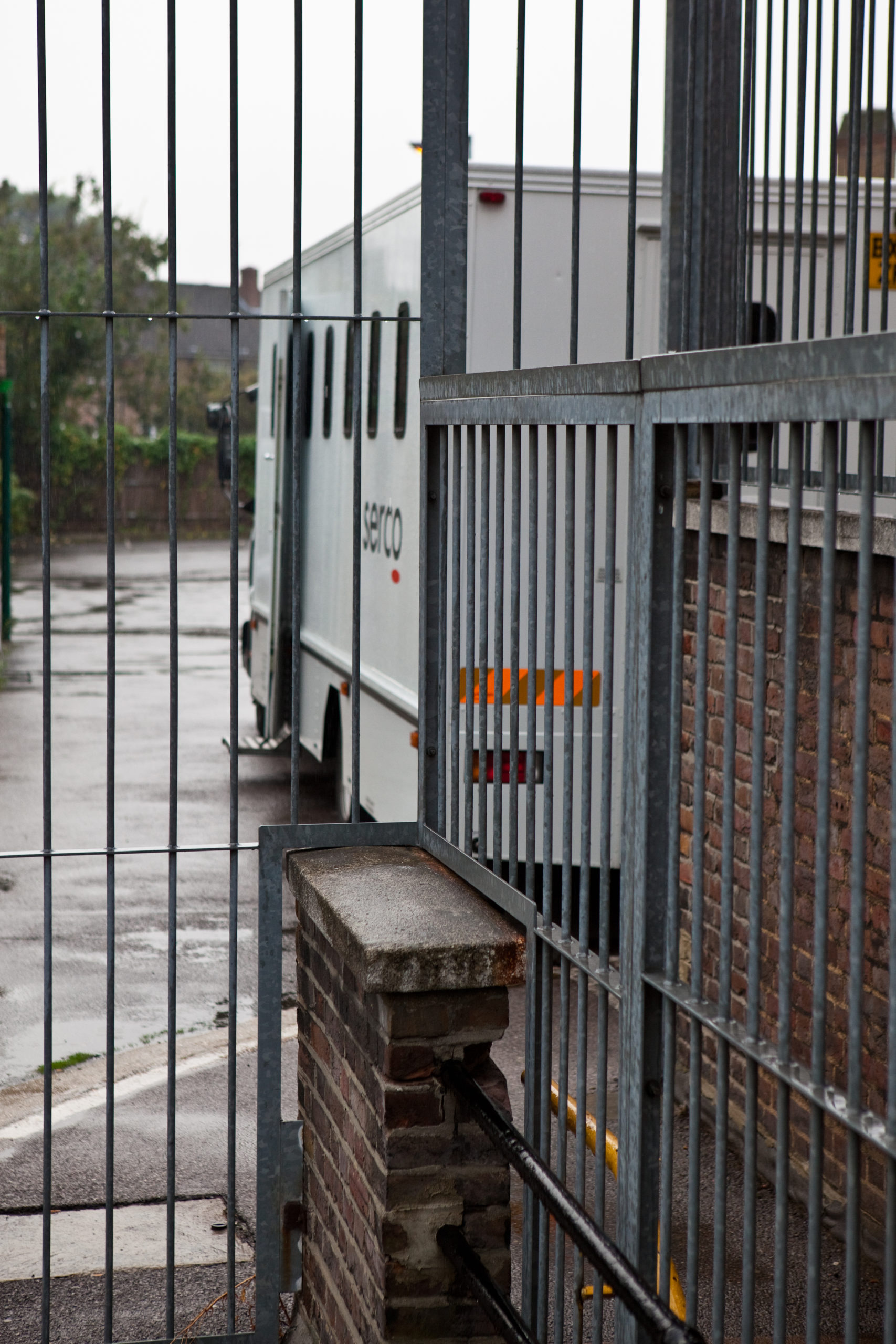 A prison van waiting outside a magistrate court to take prisoners back to prison after their court hearings.