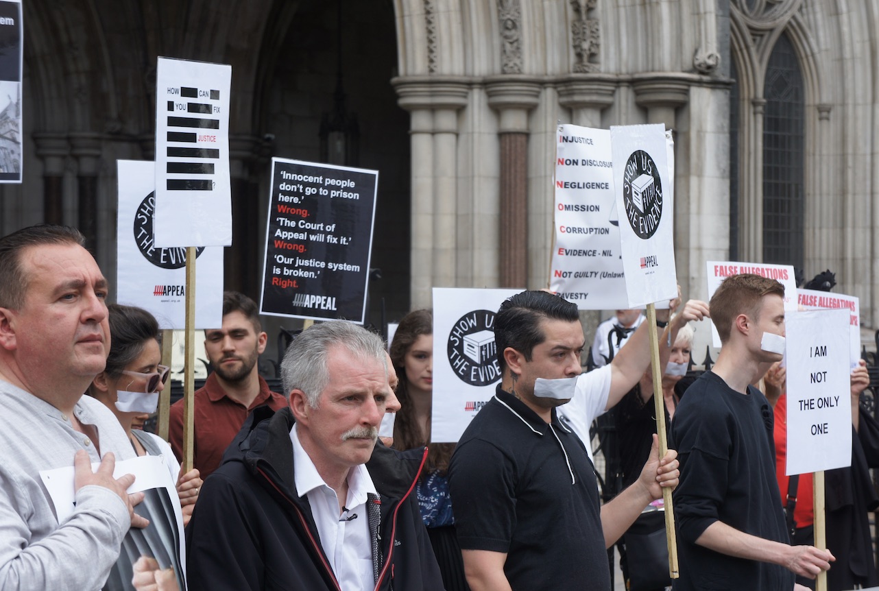Miscarriage of justice campaigners hold silent vigil at Royal Courts of Justice