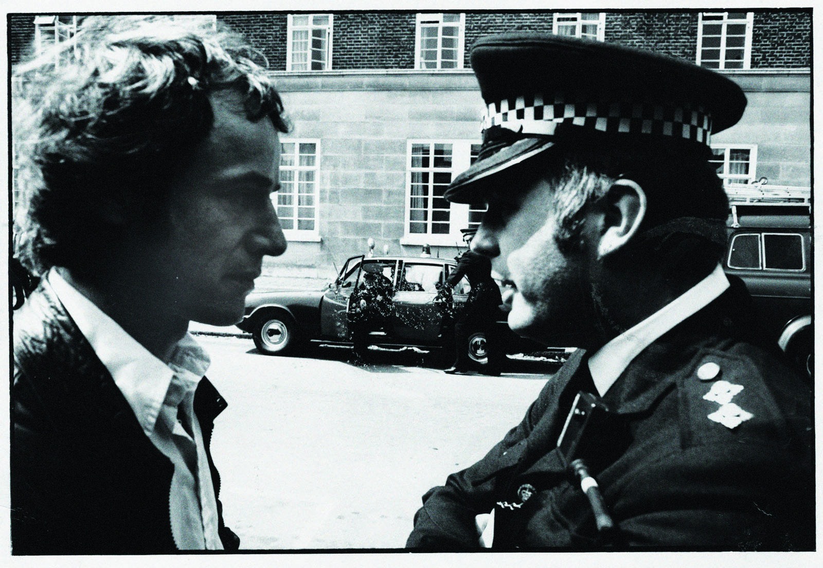 Duncan Campbell talking to a police officer at a demonstration in the 1980's.  Credit unknown.  Supplied by Duncan Campbell